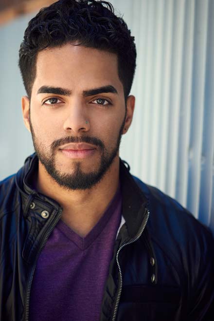 Male latino actor in natural light headshot with relaxed expression