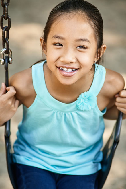 Acting headshot of girl on swing at DeLongpre Park in Hollywood