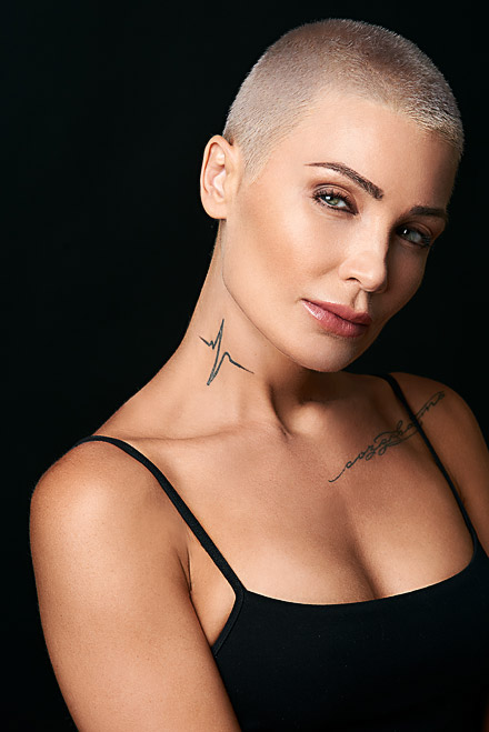 Theatrical headshot of beautiful actress with tattoos