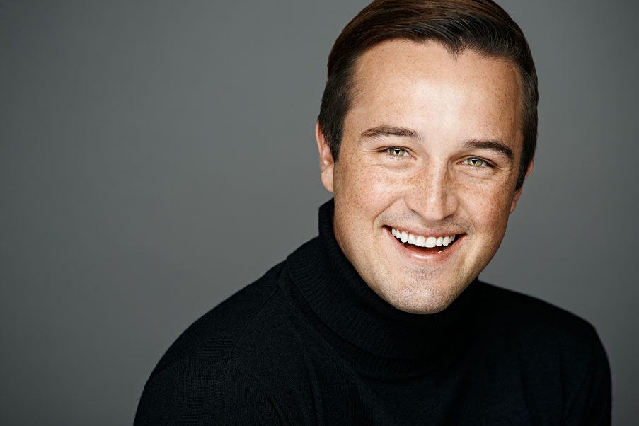 Studio headshot of smiling male actor. Photographed by Antonio Carrasco in Los Angeles, California.